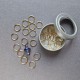 Set of stitch markers (30 gold + 1 main purple)